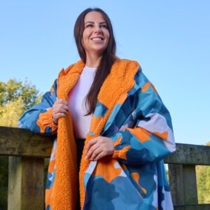 Close-up of OHS Adults Water Resistant Camo Sherpa Drying Robe from Online Home Shop showing soft orange sherpa fleece lining