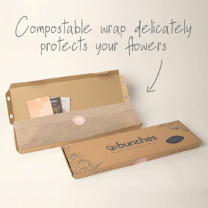 Buttercream Bliss Letterbox flower packaging from Bunches showing the slim cardboard letterbox delivery box and protective paper wrap