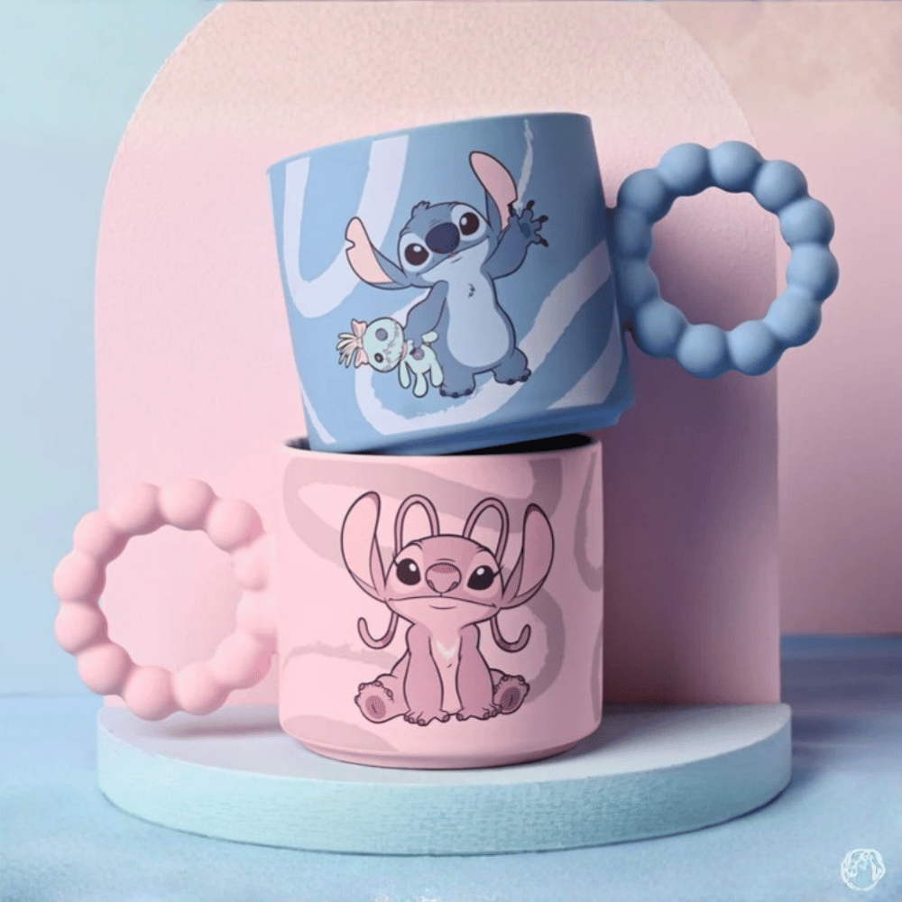 Disney Stitch and Angel ceramic mugs stacked showing blue Stitch mug and pink Angel mug with textured handles