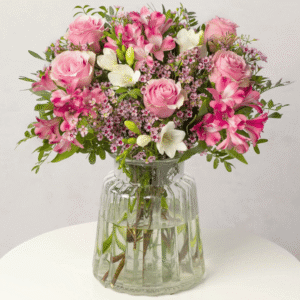 Pink Roses and Freesias from Bunches showing a soft pink and white floral bouquet with greenery