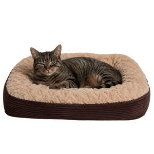 Tabby cat resting on the brown extra-large Soft Faux Fur Ribbed Pet Bed from OHS
