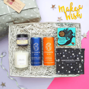 The Happy Birthday Gift Box with a large candle, lavender hand cream, self-heating eye mask and praline truffles.