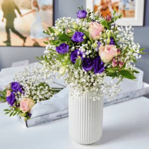 Blossoming Gifts Elegance Letterbox Flower Bouquet from Card Factory showing pink roses, purple alstroemeria and purple lisianthus with baby's breath and greenery.