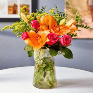 Blossoming Gifts Cheerful Lily & Rose Flower Bouquet from Card Factory showing orange lilies, pink roses and yellow solidago in a colourful arrangement
