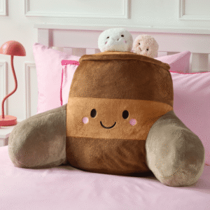 OHS Hot Chocolate brown character cuddle cushion on a bed